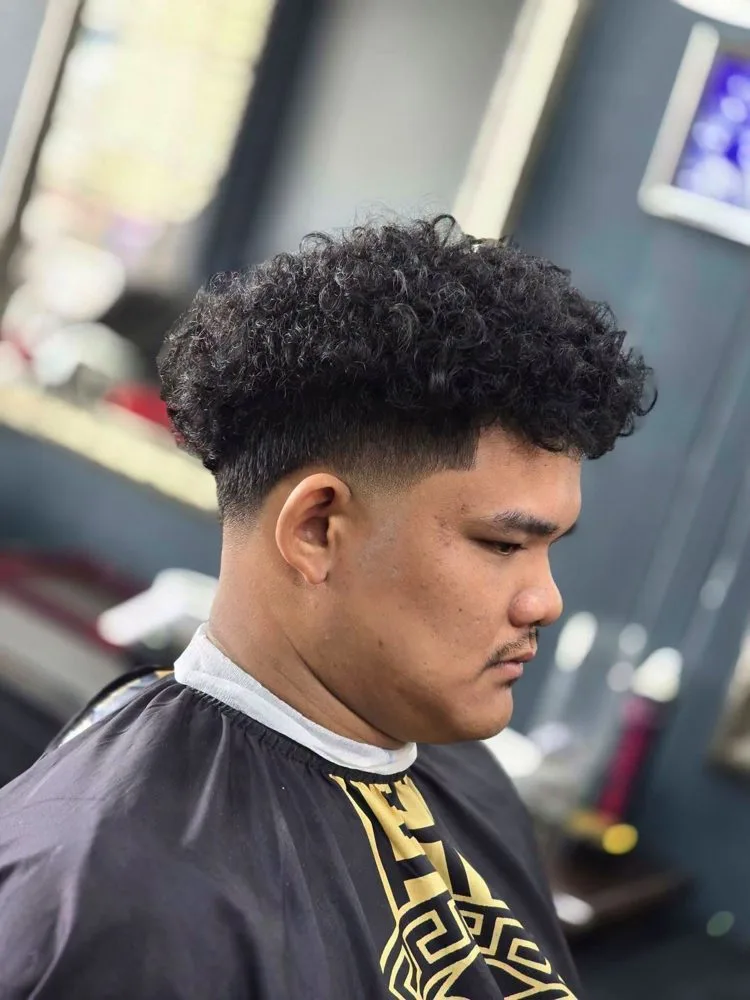 Voluminous curls with taper