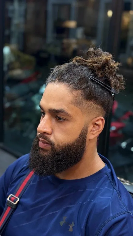 Curly top with beard and fade