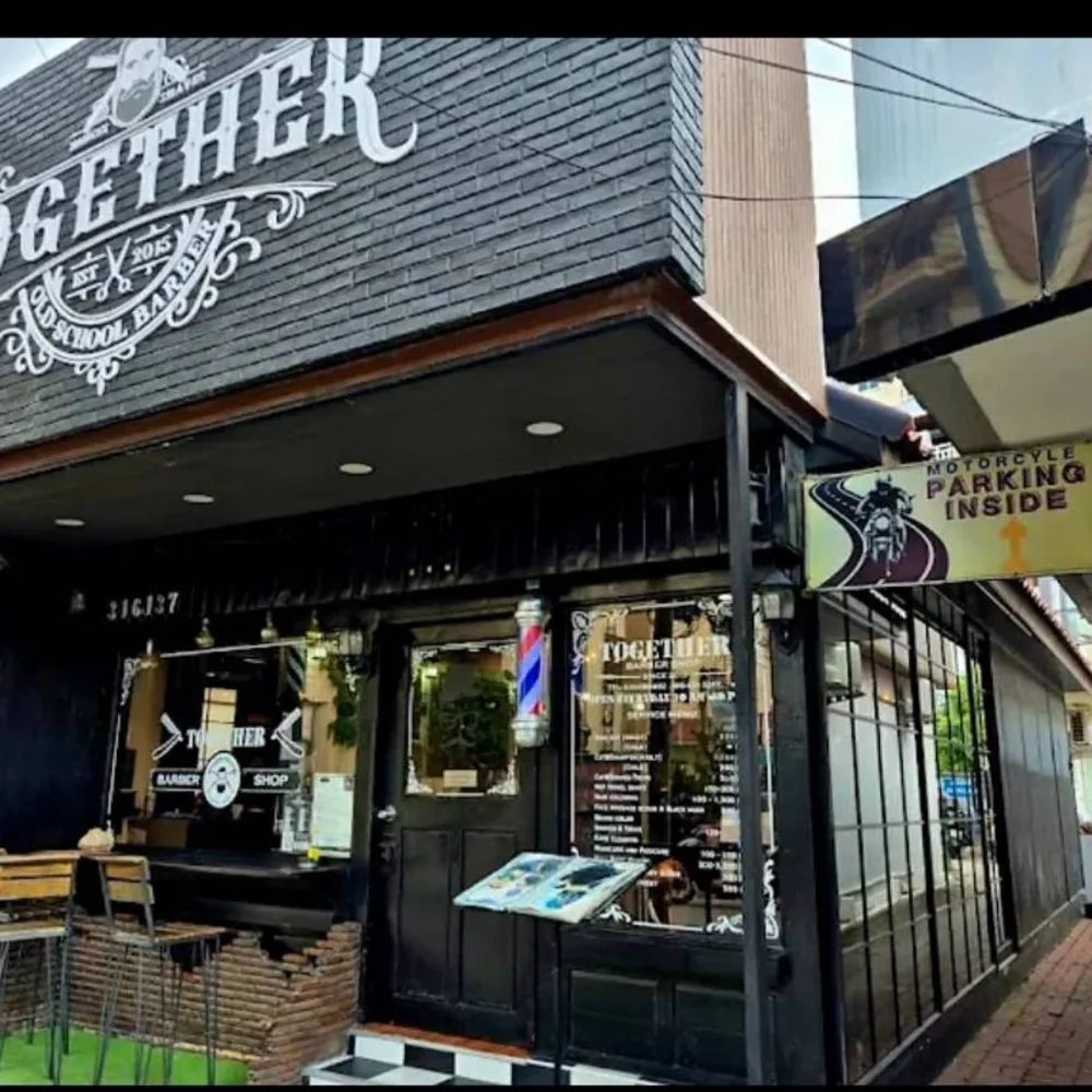 Soi Buakhao branch with its black Together sign and wooden lattice front