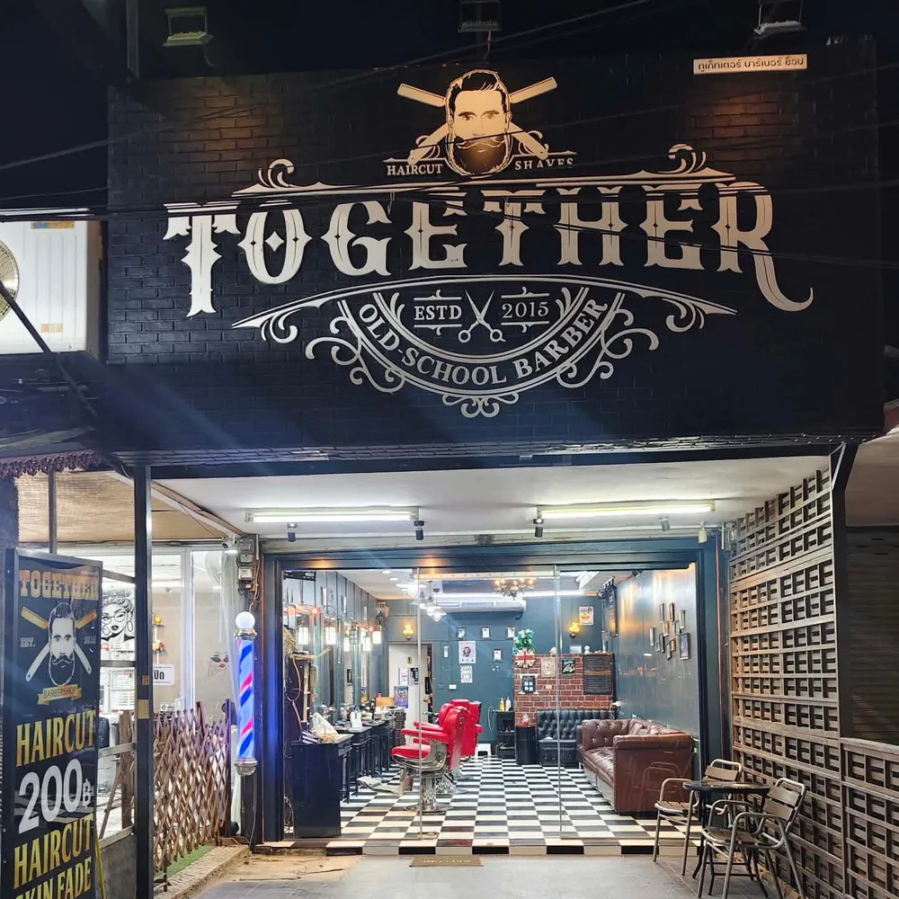 Thepprasit branch with its Together Old School Barber sign, checkerboard floor and red barber chair