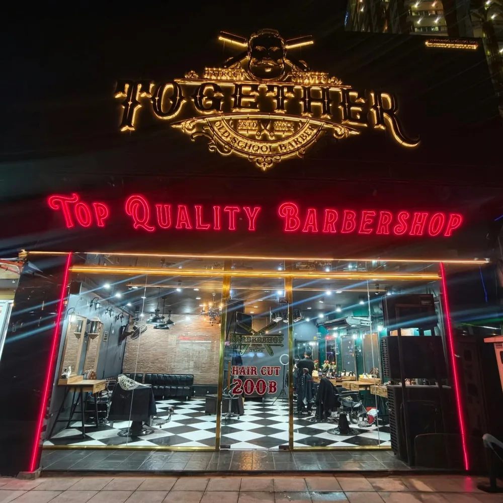 Together Old School Barber with a gold sign and red neon at night